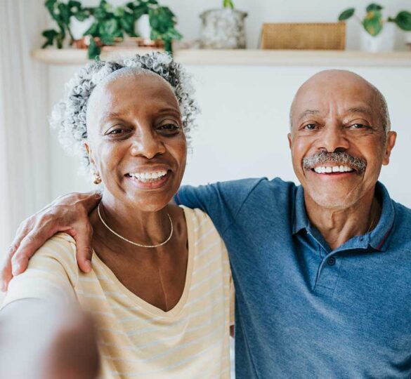 Older African-American couple taking a selfie photo